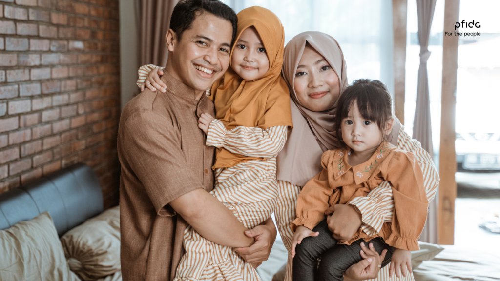 Muslim family of four posing for the camera | Exploring Halal Homeownership in the UK