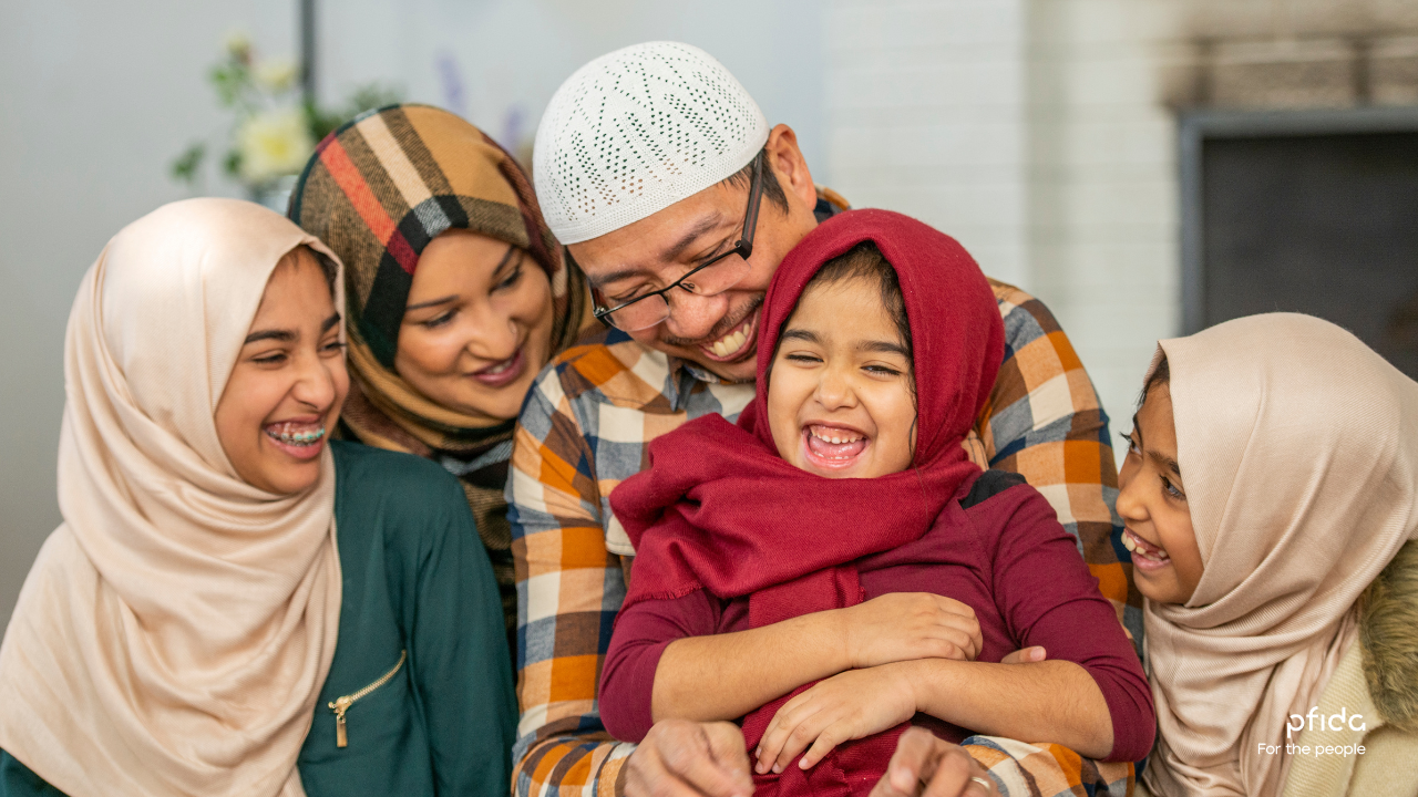 Muslim family sharing a happy moment | 3 Key Insights from Pfida's Shariah-Compliant Home Finance Podcast with Sheikh Asim Khan